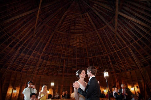 bride and groom dancing round barn wedding