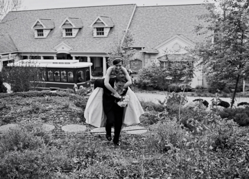 groom carrying bride piggyback